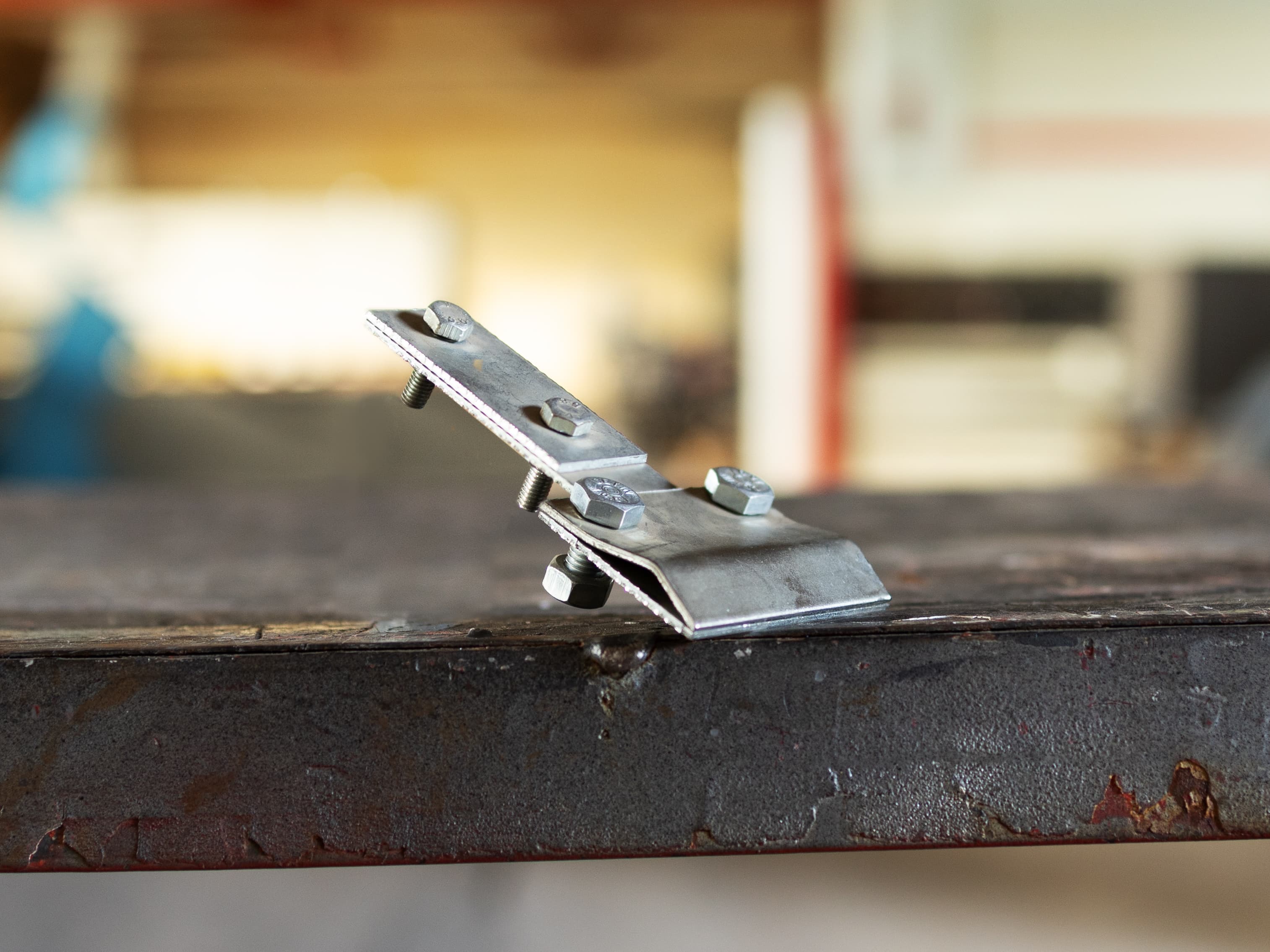 Holder for a corrugated sheet